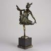 High Kick by Bruno Zach an Antique Bronze Figure of an energetic dancer with her leg raised high. The surface of the bronze with excellent deep rich colour and very fine hand finished detail, raised on a marble base  