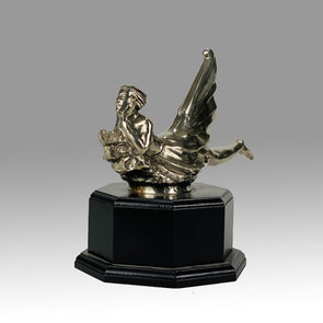 Wave rider Car bonnet mascot by Georges Delperier  in the form of a winged woman laying on her front in a casual pose riding on top of a wave, with very fine hand finished detail. Raised on an octagonal wooden plinth