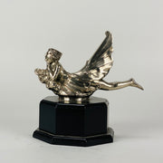 Wave rider Car bonnet mascot by Georges Delperier  in the form of a winged woman laying on her front in a casual pose riding on top of a wave, with very fine hand finished detail. Raised on an octagonal wooden plinth