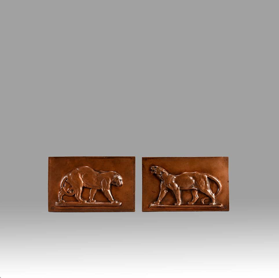 Panther and Leopard Plaques by Antoine L Barye one decorated with a striding panther the other of a striding leopard. The bronze plaques with excellent hand chased surface detail and very fine rich mid to golden brown patina
