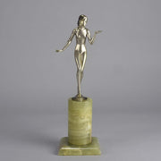 Art Deco Lady by Adolph in a questioning pose with one hand out, signed Adolph and raised on a tall cylindrical Brazilian green onyx base