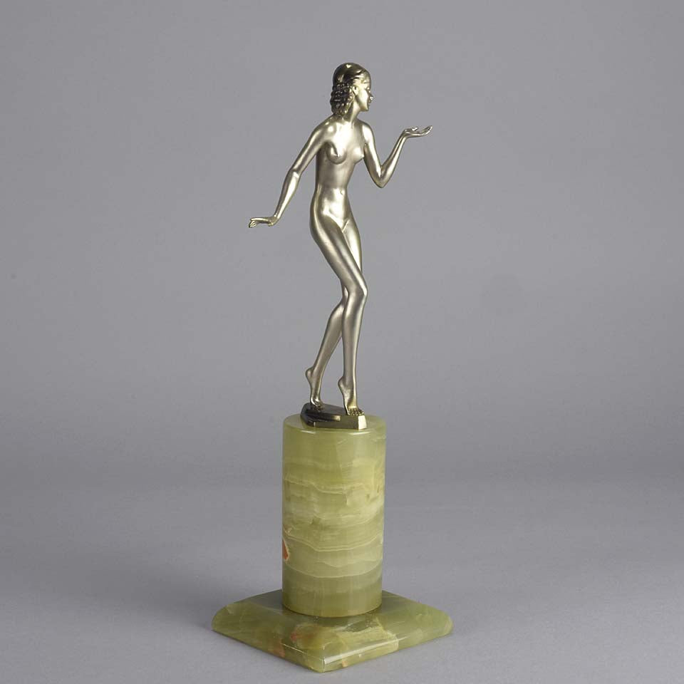 Art Deco Lady by Adolph in a questioning pose with one hand out, signed Adolph and raised on a tall cylindrical Brazilian green onyx base