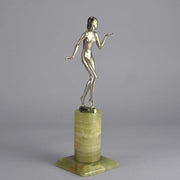 Art Deco Lady by Adolph in a questioning pose with one hand out, signed Adolph and raised on a tall cylindrical Brazilian green onyx base