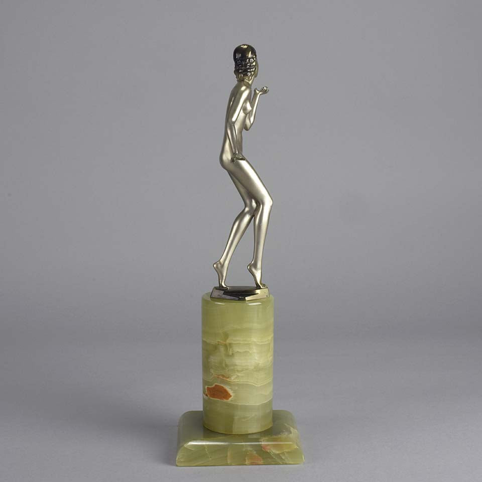Art Deco Lady by Adolph in a questioning pose with one hand out, signed Adolph and raised on a tall cylindrical Brazilian green onyx base