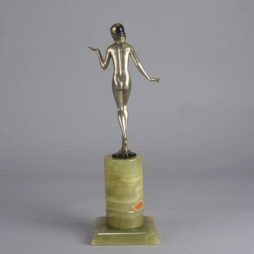 Art Deco Lady by Adolph in a questioning pose with one hand out, signed Adolph and raised on a tall cylindrical Brazilian green onyx base