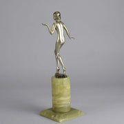 Art Deco Lady by Adolph in a questioning pose with one hand out, signed Adolph and raised on a tall cylindrical Brazilian green onyx base