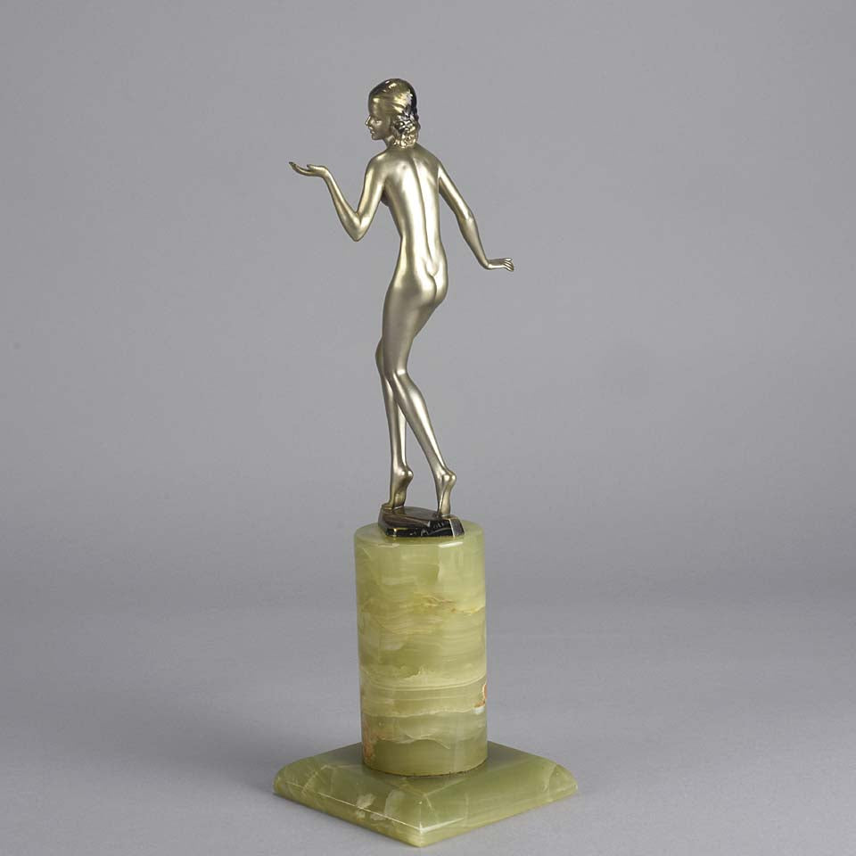 Art Deco Lady by Adolph in a questioning pose with one hand out, signed Adolph and raised on a tall cylindrical Brazilian green onyx base