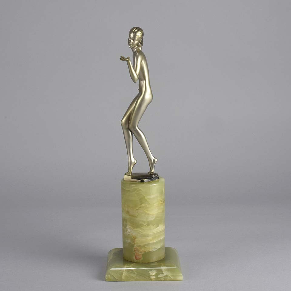Art Deco Lady by Adolph in a questioning pose with one hand out, signed Adolph and raised on a tall cylindrical Brazilian green onyx base