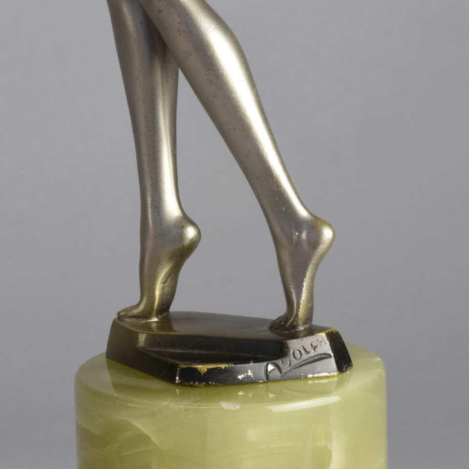 Art Deco Lady by Adolph in a questioning pose with one hand out, signed Adolph and raised on a tall cylindrical Brazilian green onyx base