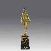 Alexandrian Dancer by Demetre Chiparus A fabulous Art Deco gilt bronze figure of a beautiful Egyptian dancer in full dance costume with her arms held by her sides, hand finished in stunning gilded and cold painted enamel colour, raised on a portoro marble base