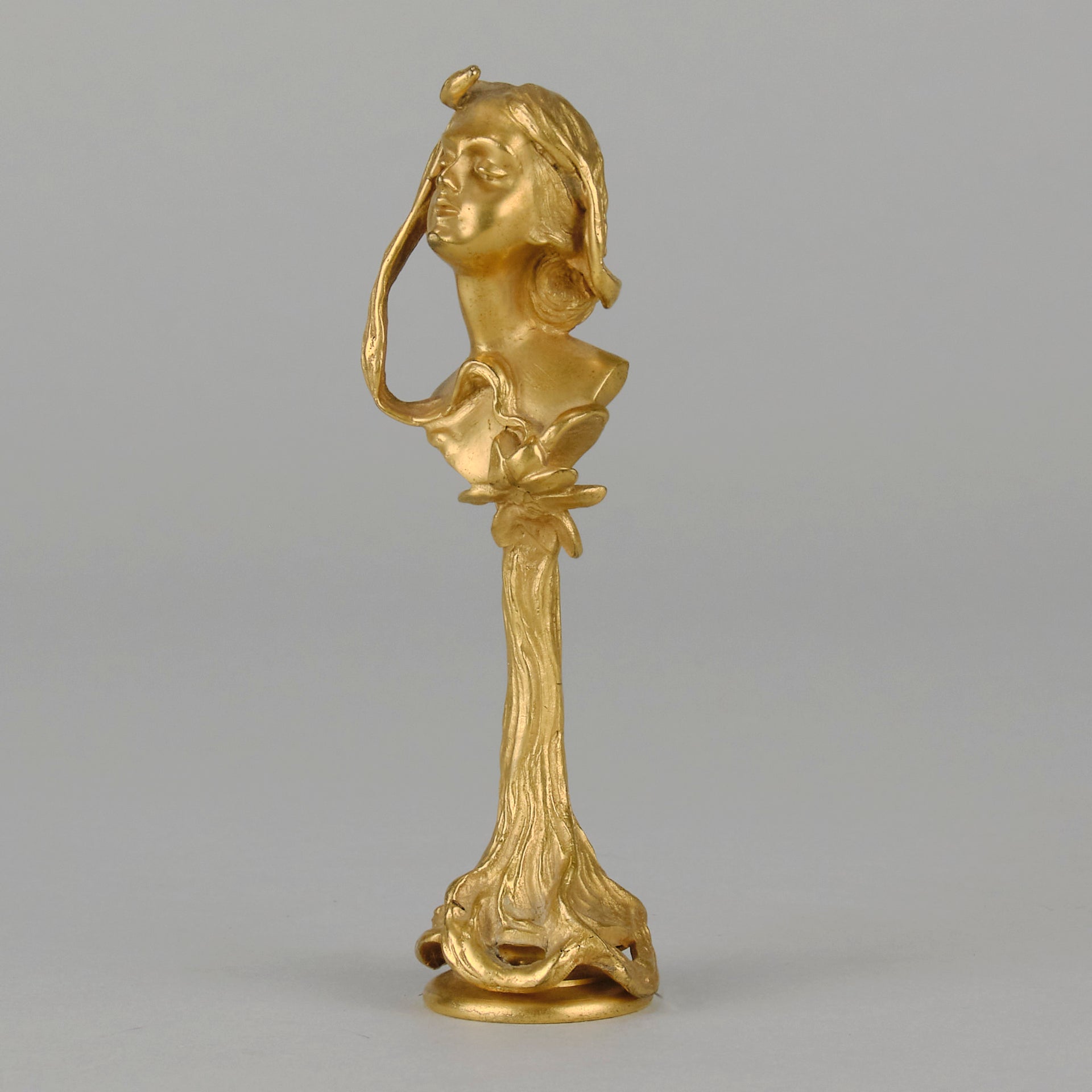 Art Nouveau Desk Seal a very fine early 20th Century French gilt bronze desk seal modelled as the head and shoulders of an Art Nouveau maiden with organic theme decorated with flowers