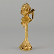 Art Nouveau Desk Seal a very fine early 20th Century French gilt bronze desk seal modelled as the head and shoulders of an Art Nouveau maiden with organic theme decorated with flowers