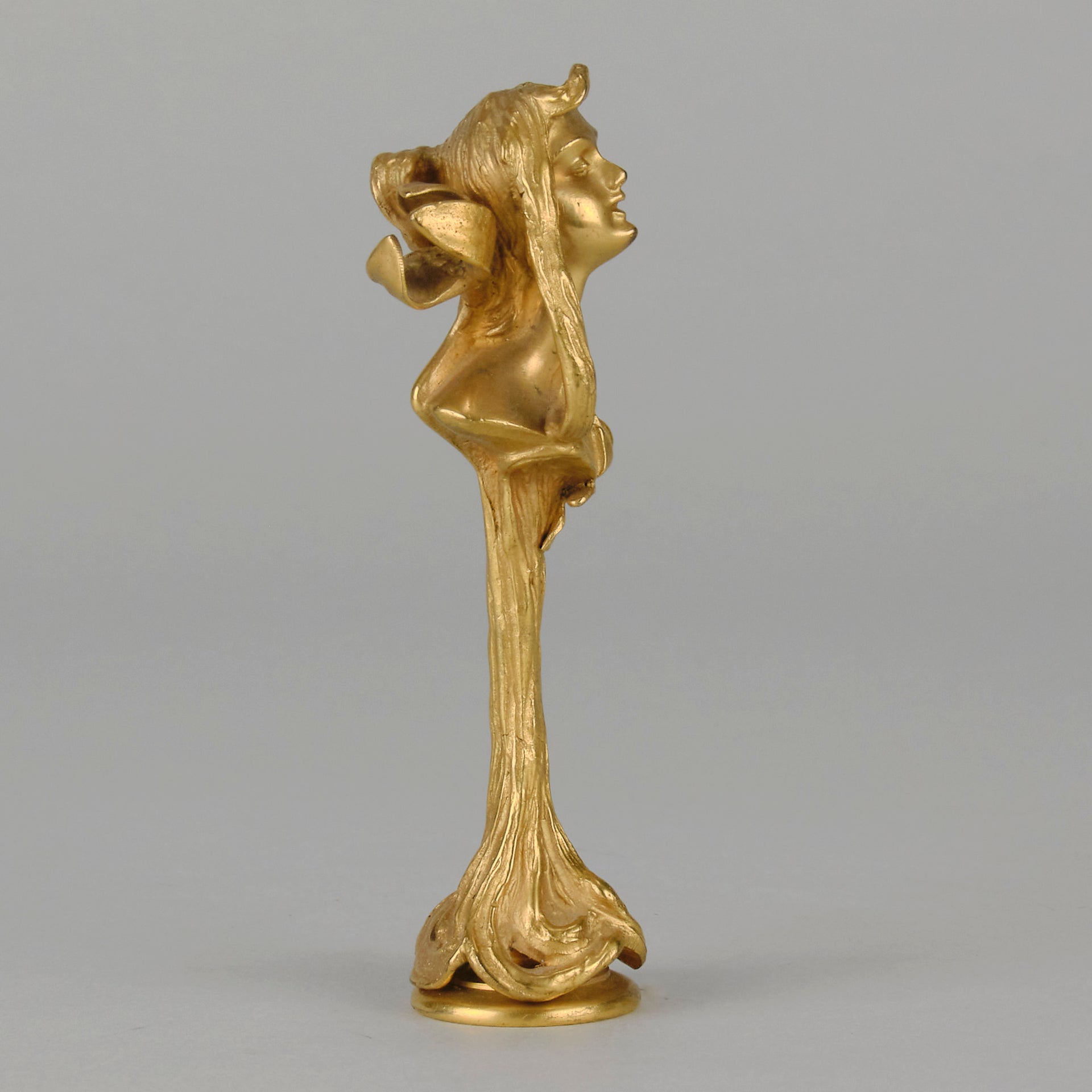 Art Nouveau Desk Seal a very fine early 20th Century French gilt bronze desk seal modelled as the head and shoulders of an Art Nouveau maiden with organic theme decorated with flowers