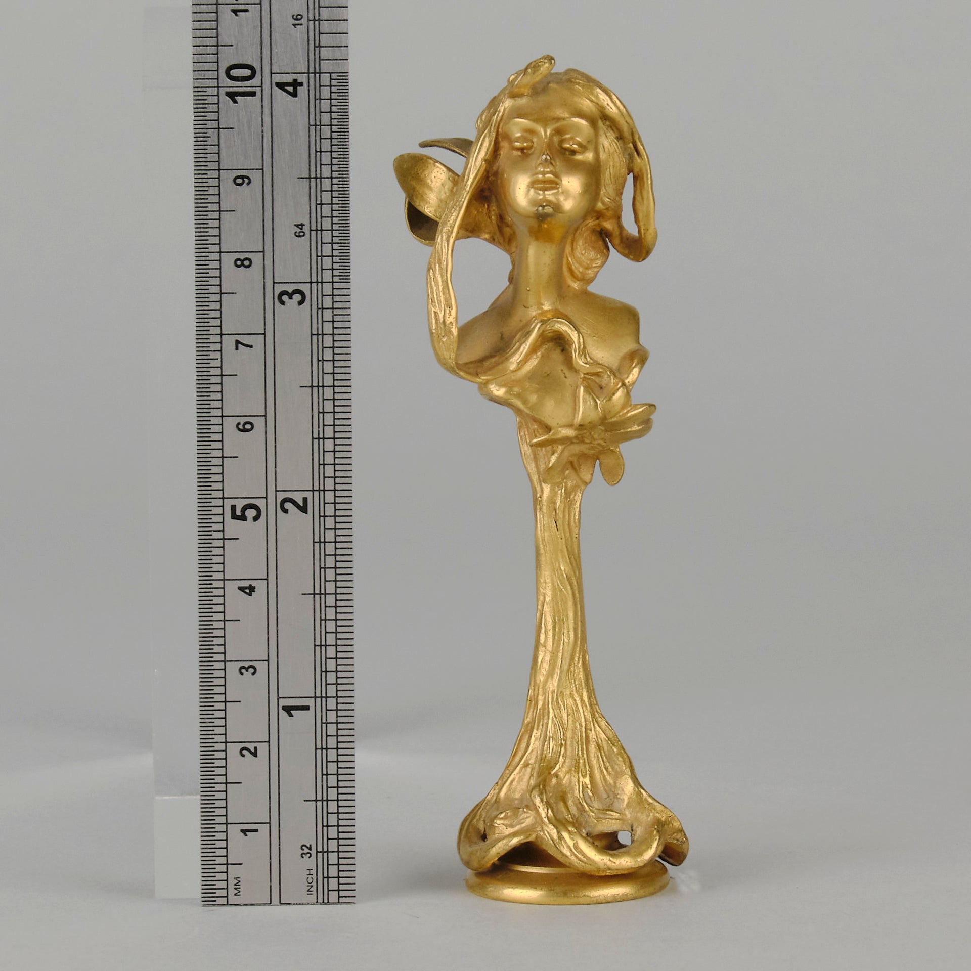 Art Nouveau Desk Seal a very fine early 20th Century French gilt bronze desk seal modelled as the head and shoulders of an Art Nouveau maiden with organic theme decorated with flowers