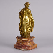 An antique bronze figure of an Art Nouveau Lady a gilt bronze figure of a very beautiful lady, her diaphonous clothing seductively draped over her body 