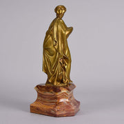 An antique bronze figure of an Art Nouveau Lady a gilt bronze figure of a very beautiful lady, her diaphonous clothing seductively draped over her body 