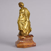 An antique bronze figure of an Art Nouveau Lady a gilt bronze figure of a very beautiful lady, her diaphonous clothing seductively draped over her body 