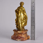 An antique bronze figure of an Art Nouveau Lady a gilt bronze figure of a very beautiful lady, her diaphonous clothing seductively draped over her body 