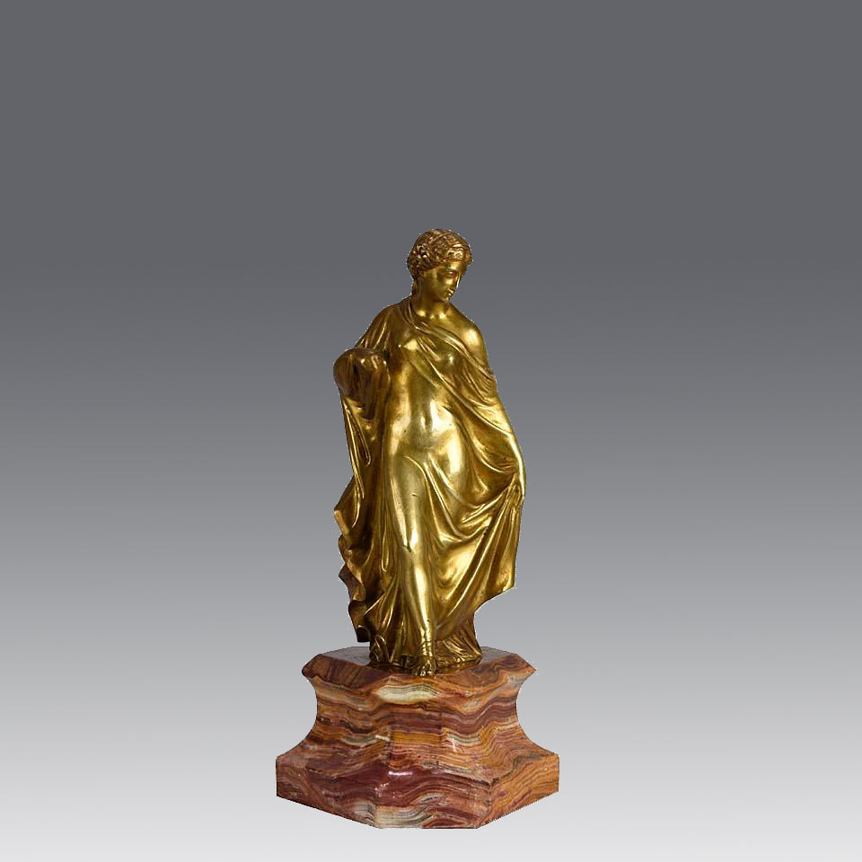 An antique bronze figure of an Art Nouveau Lady a gilt bronze figure of a very beautiful lady, her diaphonous clothing seductively draped over her body 
