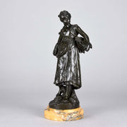 Autumn an antique bronze figure by Auguste Moreau a figure of a young farm girl carrying a laden basket with very fine colour and excellent had finished surface detail, raised on a marble base 