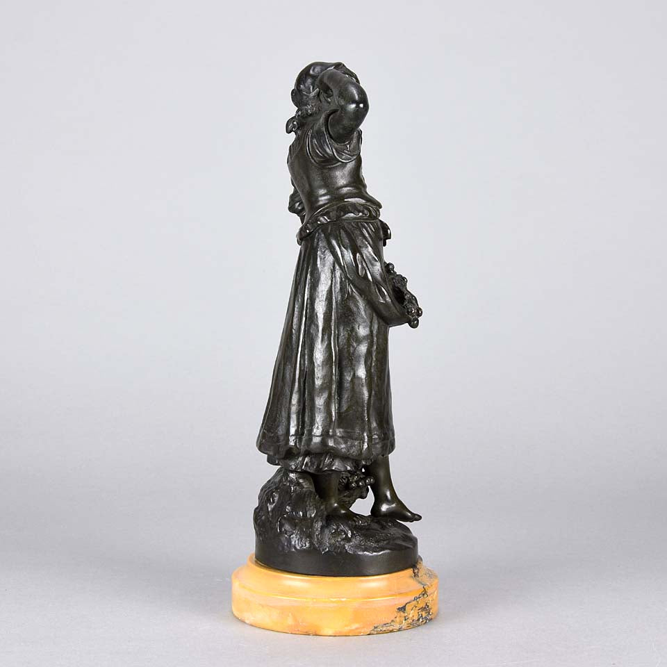 Summer by Auguste Moreau an antique bronze figure of a young girl in period clothing carrying an arm full of fruits with a basket full by her side, with excellent surface detail 
