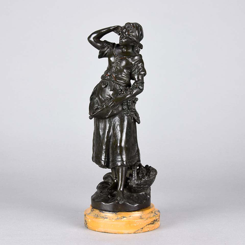 Summer by Auguste Moreau an antique bronze figure of a young girl in period clothing carrying an arm full of fruits with a basket full by her side, with excellent surface detail 