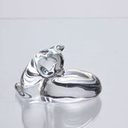 A charming mid 20th Century clear glass study of a relaxed cat in a reclining position grooming itself, with excellent smooth tactile surface, signed under base 