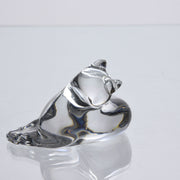 A charming mid 20th Century clear glass study of a relaxed cat in a reclining position grooming itself, with excellent smooth tactile surface, signed under base 