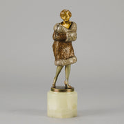Fur Coat by Barner An excellent early 20th Century Austrian bronze figure of an Art Deco beauty in a large fur coat - Hickmet Fine Arts