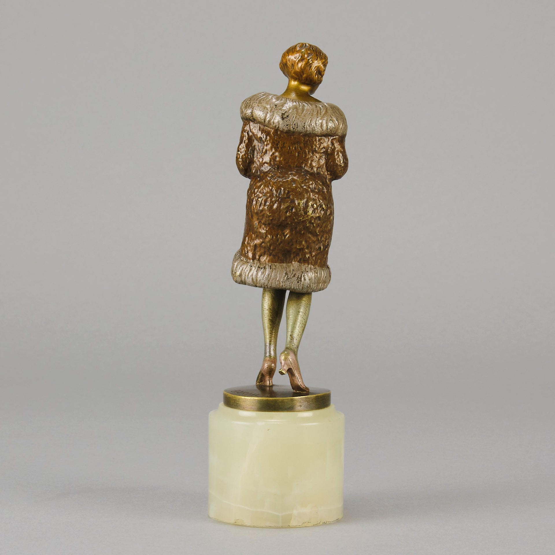 Fur Coat by Barner An excellent early 20th Century Austrian bronze figure of an Art Deco beauty in a large fur coat - Hickmet Fine Arts