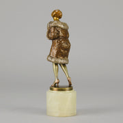 Fur Coat by Barner An excellent early 20th Century Austrian bronze figure of an Art Deco beauty in a large fur coat - Hickmet Fine Arts