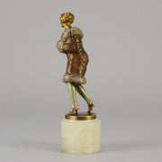 Fur Coat by Barner An excellent early 20th Century Austrian bronze figure of an Art Deco beauty in a large fur coat - Hickmet Fine Arts