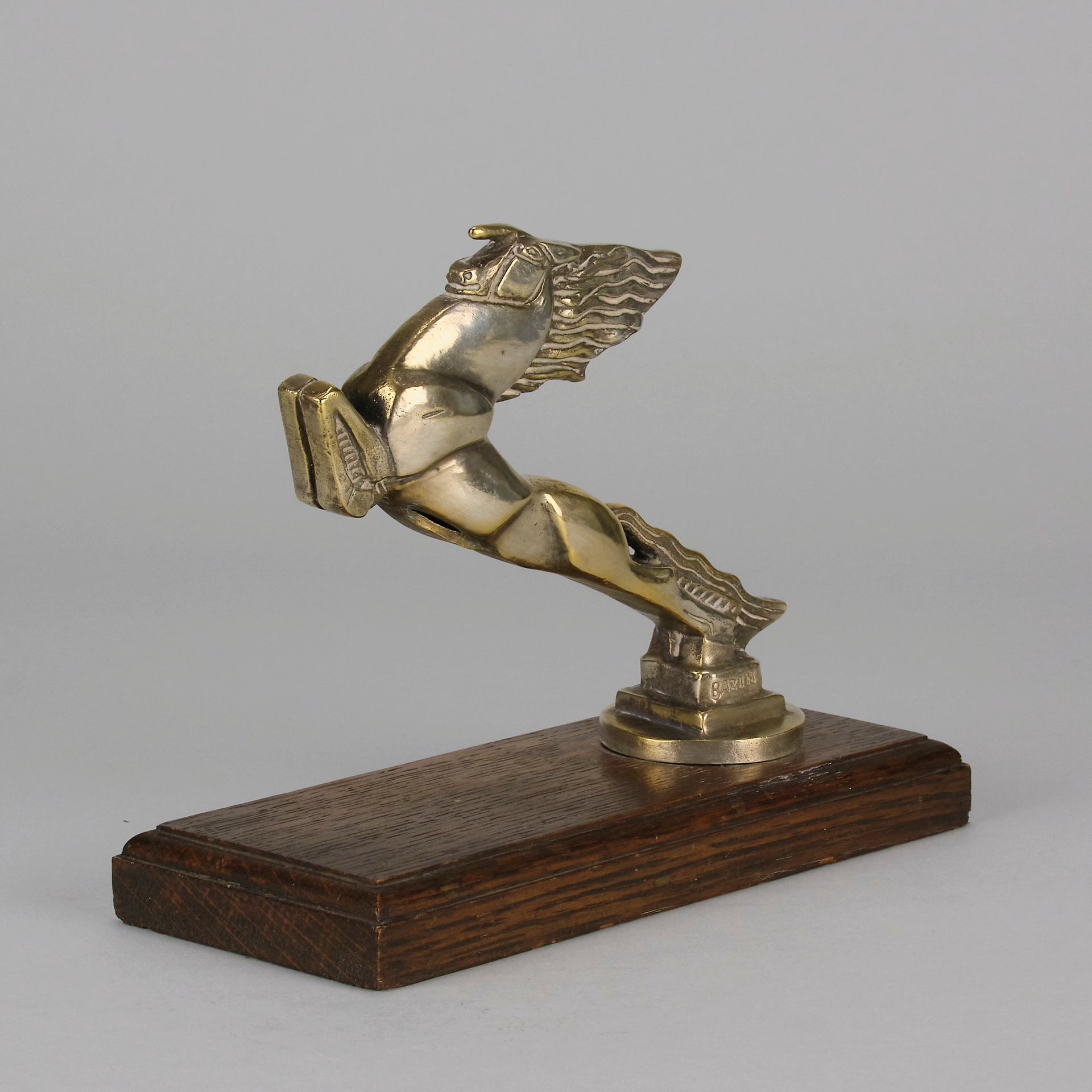 Leaping Horse Car Bonnet Mascot by François Bazin  silver plated in the form of a leaping horse, with fine detail. Raised on a wooden rectangular base