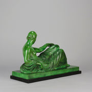 Femme Allongée early 20th Century French Art Deco bronze figure of a resting beauty reclining on a day bed with a shawl delicately draped over her by Gaston Béguin - Hickmet Fine Arts 