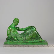 Femme Allongée early 20th Century French Art Deco bronze figure of a resting beauty reclining on a day bed with a shawl delicately draped over her by Gaston Béguin - Hickmet Fine Arts 