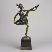 High Kick by Bruno Zach an Antique Bronze Figure of an energetic dancer with her leg raised high. The surface of the bronze with excellent deep rich colour and very fine hand finished detail, raised on a marble base  
