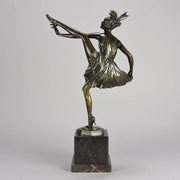 High Kick by Bruno Zach an Antique Bronze Figure of an energetic dancer with her leg raised high. The surface of the bronze with excellent deep rich colour and very fine hand finished detail, raised on a marble base  