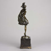High Kick by Bruno Zach an Antique Bronze Figure of an energetic dancer with her leg raised high. The surface of the bronze with excellent deep rich colour and very fine hand finished detail, raised on a marble base  