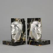 Art Deco silvered bronze bookends in the form of two Pharoah heads mounted on marble bases by Charles Charles - Hickmet Fine Arts