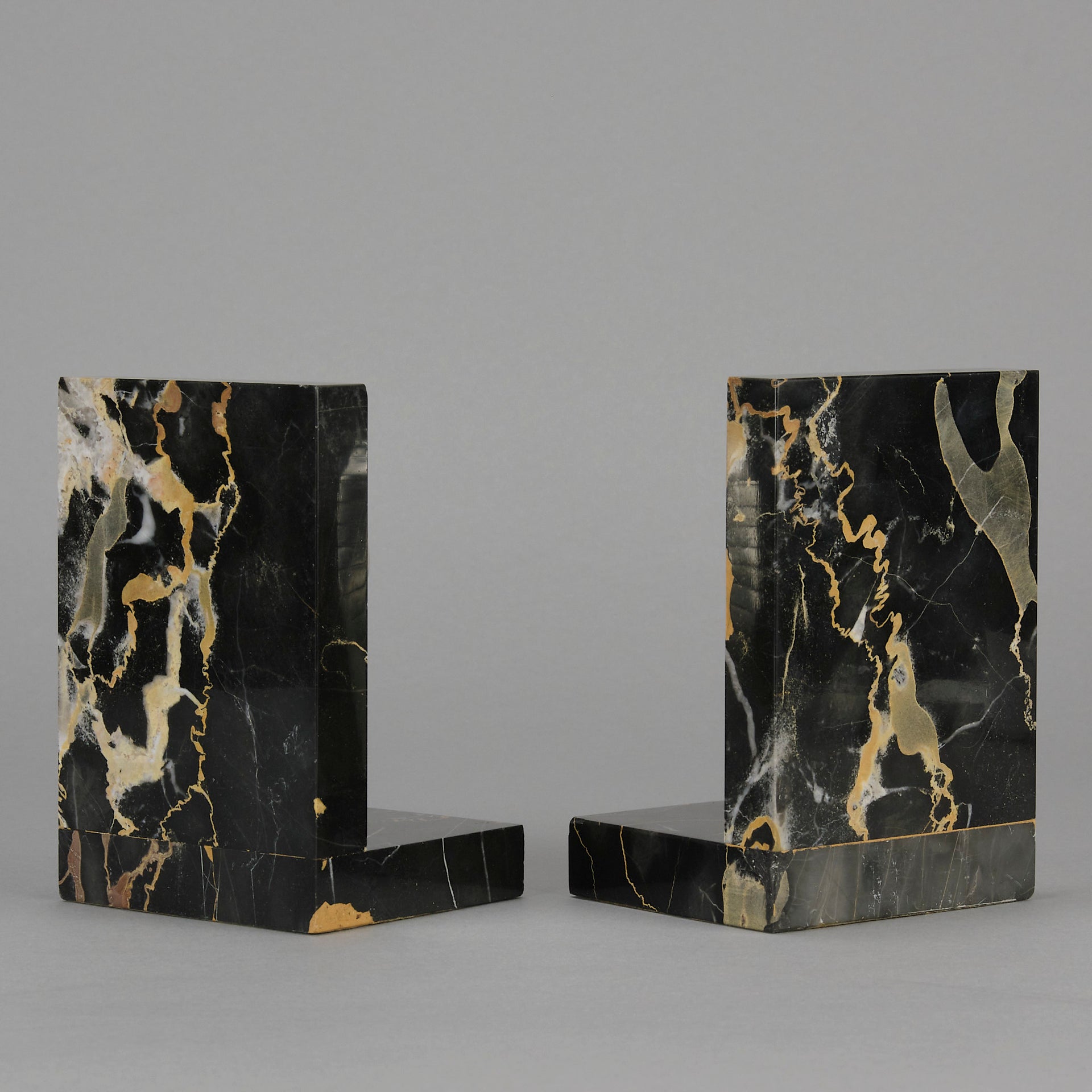 Art Deco silvered bronze bookends in the form of two Pharoah heads mounted on marble bases by Charles Charles - Hickmet Fine Arts