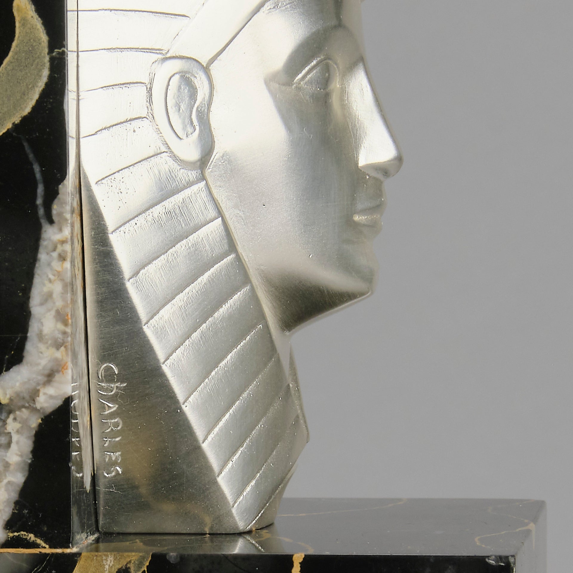 Art Deco silvered bronze bookends in the form of two Pharoah heads mounted on marble bases by Charles Charles - Hickmet Fine Arts