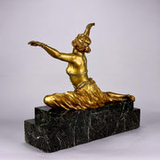 An antique bronze figure Theban Dancer by CJ R Colinet gilt and enamel bronze figure of a seated dancer wearing an exotic and revealing costume, with very fine gilt and enamel colour and excellent detail,