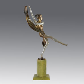 Charlotte by Josef Lorenzl a fabulous early 20th Century Art Deco cold painted bronze figure of a young woman holding an energetic pose lifting her shawl which is wrapped around her midriff.
