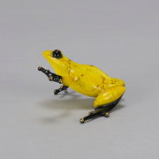 Chai - A vibrant limited edition bronze sculpture by Tim Cotterill of a yellow frog with its head raised, reaching out with its front leg, exhibiting very fine bright enamel colours and excellent tactile surface