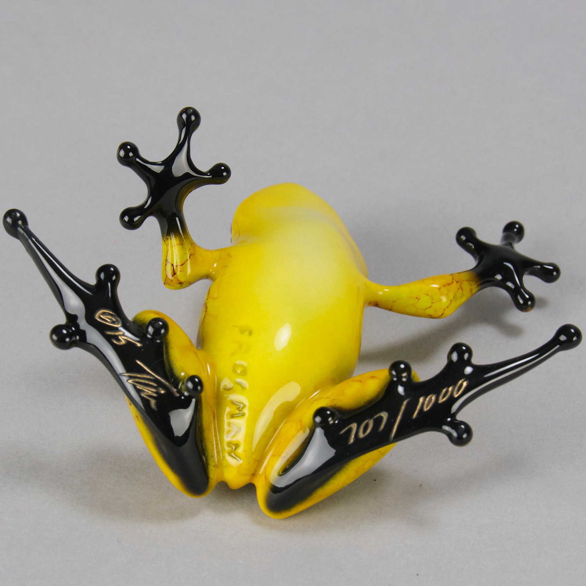 Chai - A vibrant limited edition bronze sculpture by Tim Cotterill of a yellow frog with its head raised, reaching out with its front leg, exhibiting very fine bright enamel colours and excellent tactile surface