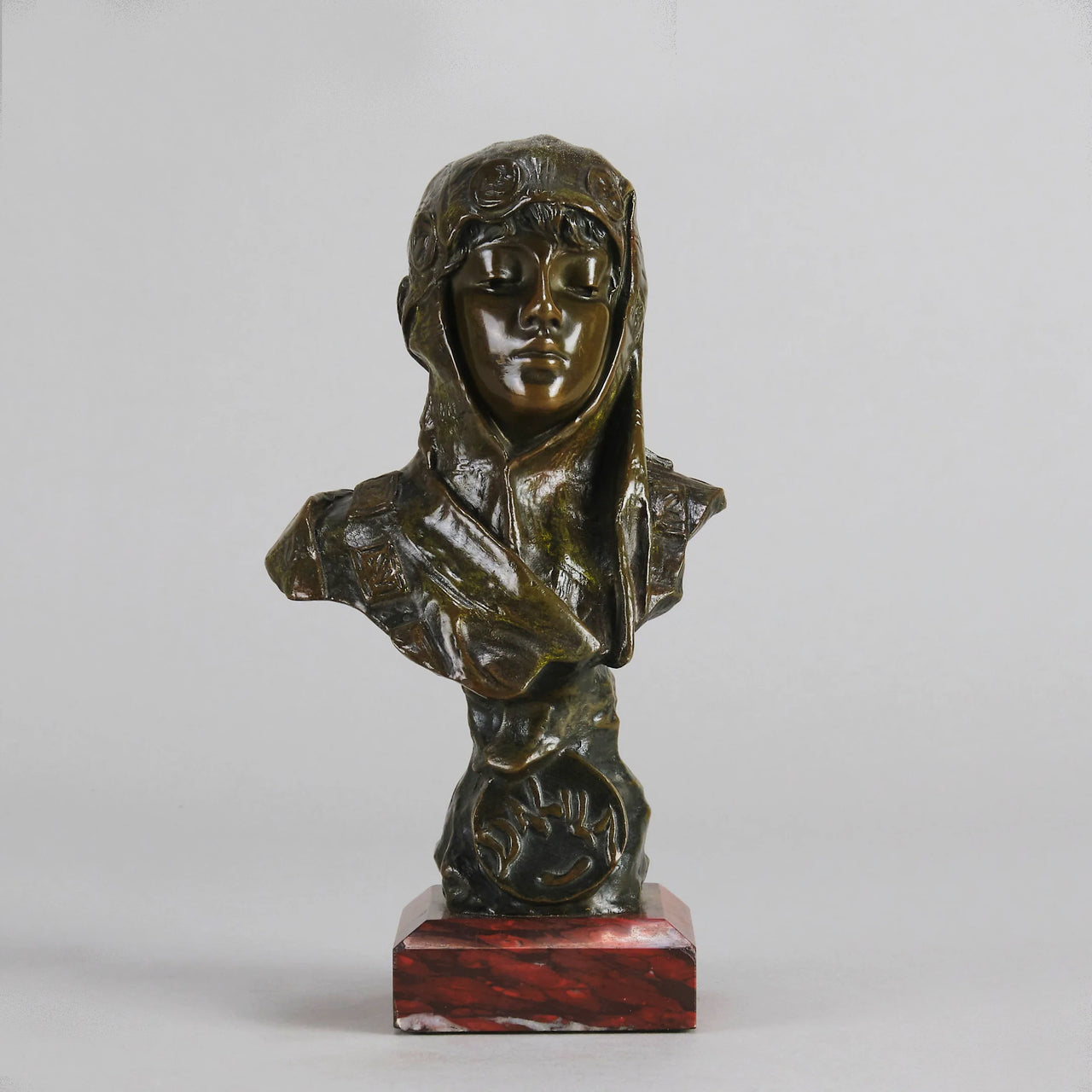 Dalila by Emmanuel Villanis a fantastic depiction of a young Deliah as a bronze bust. Covering her head with a hood