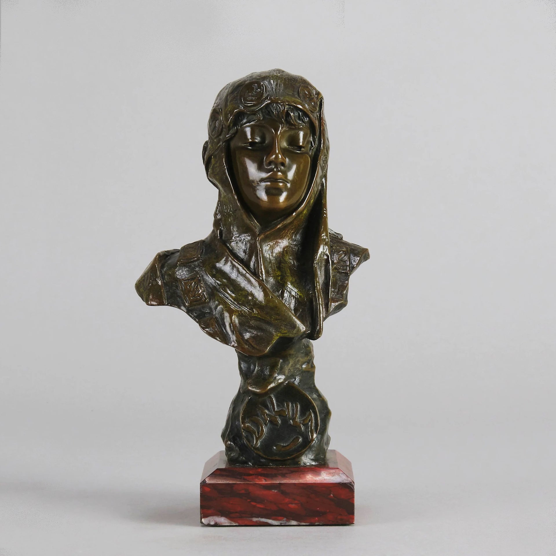 Dalila by Emmanuel Villanis a fantastic depiction of a young Deliah as a bronze bust. Covering her head with a hood