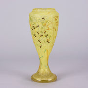 Bees and Flowers Vase by Daum Frères a late 19th Century French cameo glass vase etched and enamelled with a hive of bees pollinating flowers against a pale yellow field