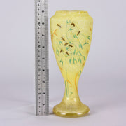 Bees and Flowers Vase by Daum Frères a late 19th Century French cameo glass vase etched and enamelled with a hive of bees pollinating flowers against a pale yellow field