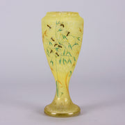 Bees and Flowers Vase by Daum Frères a late 19th Century French cameo glass vase etched and enamelled with a hive of bees pollinating flowers against a pale yellow field